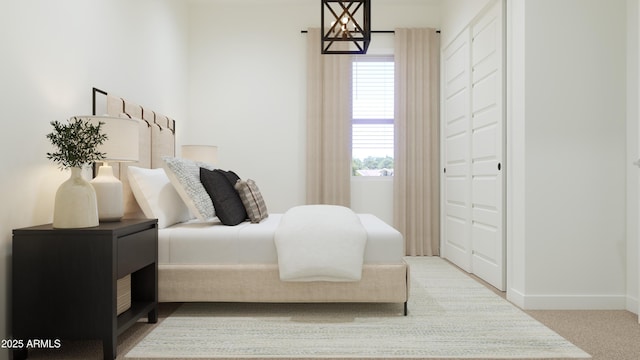 bedroom with multiple windows, carpet, baseboards, and a closet