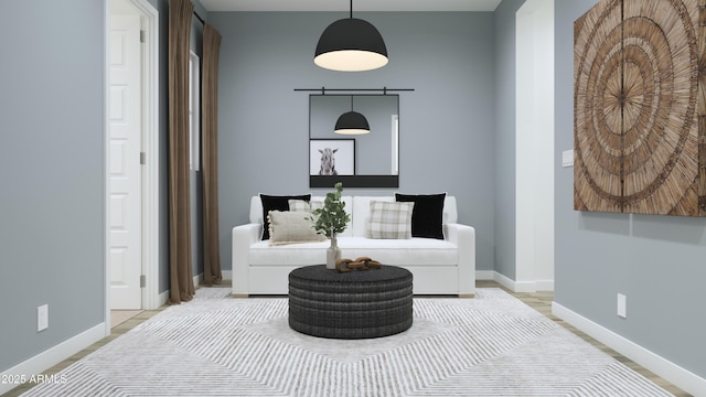 living area featuring baseboards