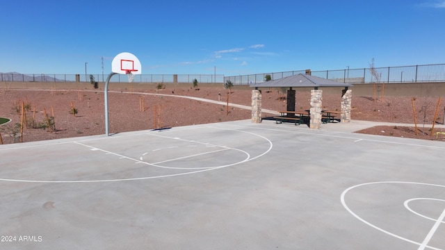 view of sport court featuring community basketball court, fence, and a gazebo