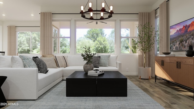 sunroom / solarium featuring a chandelier