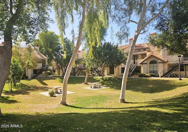 2333 E Southern Ave Unit 1015, Tempe, AZ 85282 - surrounding community with stairway, a lawn, and a wooden deck