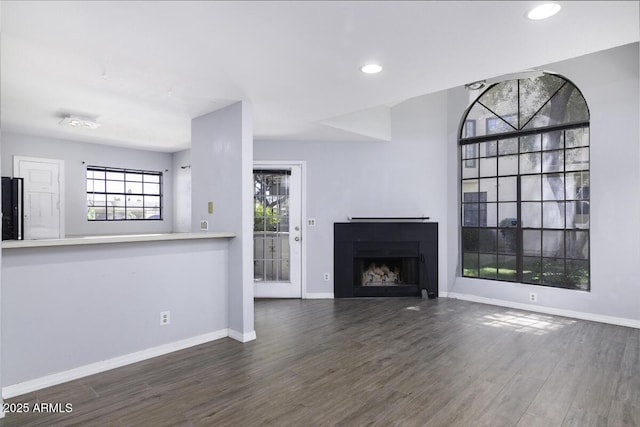 2333 E Southern Ave Unit 1015, Tempe, AZ 85282 - unfurnished living room featuring wood finished floors, a fireplace, and recessed lighting