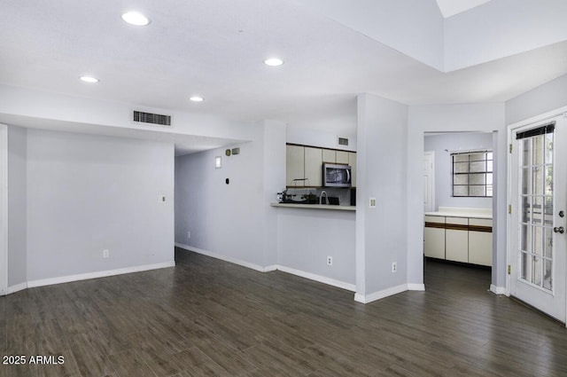 2333 E Southern Ave Unit 1015, Tempe, AZ 85282 - unfurnished living room with dark wood-type flooring and recessed lighting