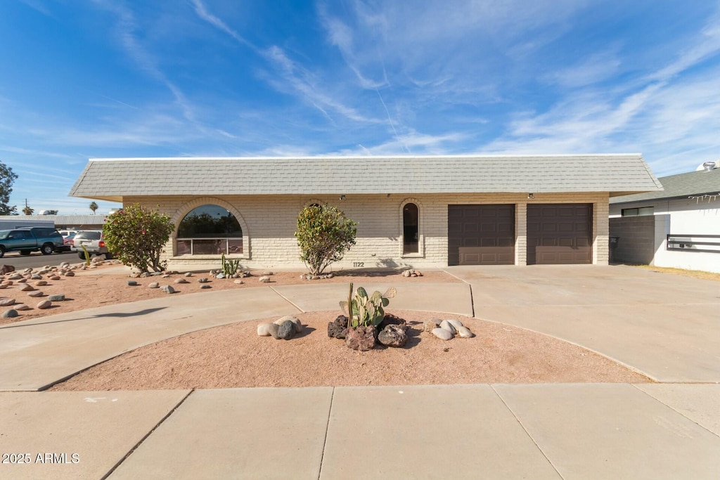 ranch-style home featuring a garage