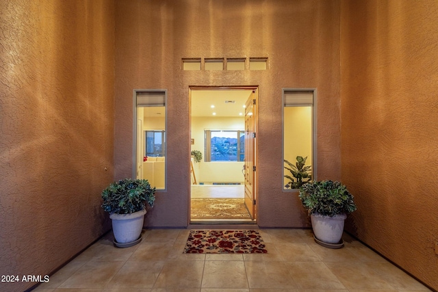 entrance to property with a patio area