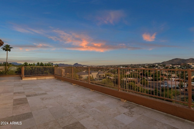 patio terrace at dusk with a mountain view