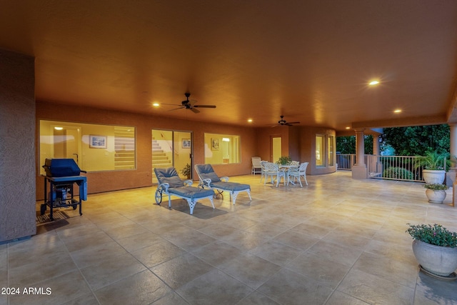 exterior space featuring ceiling fan