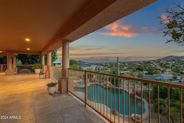 view of balcony at dusk