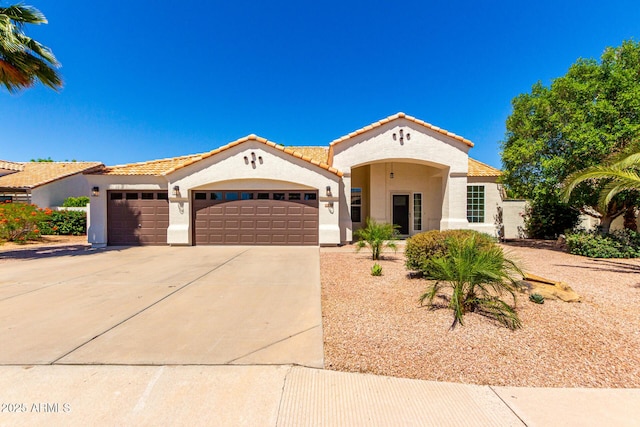 1710 S Aaron, Mesa, AZ 85209 - mediterranean / spanish home with a garage, stucco siding, concrete driveway, and a tile roof