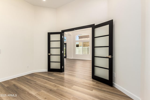 1710 S Aaron, Mesa, AZ 85209 - empty room with baseboards, wood finished floors, and a high ceiling