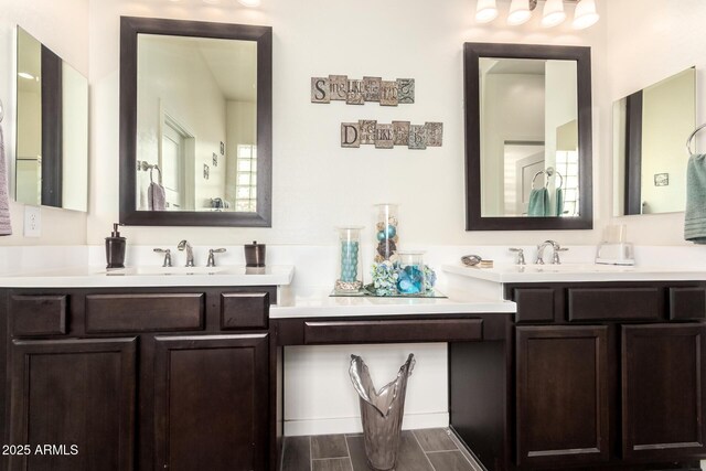bathroom featuring wood finished floors and vanity