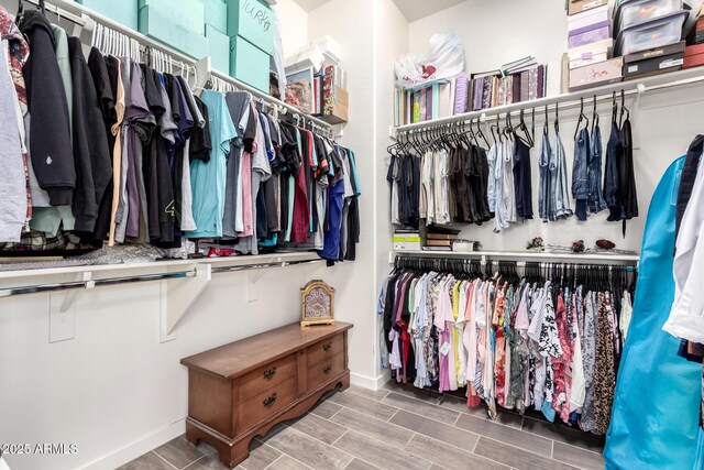 spacious closet featuring wood finished floors