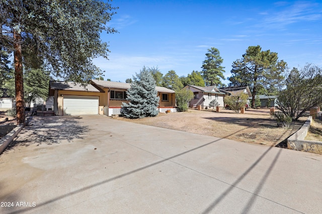 single story home with a garage