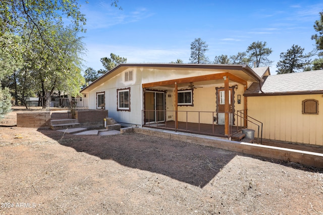 rear view of house with a patio area and ceiling fan