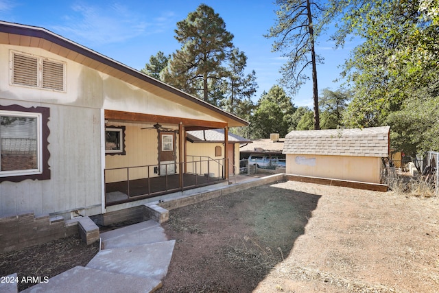 view of yard featuring a patio and ceiling fan