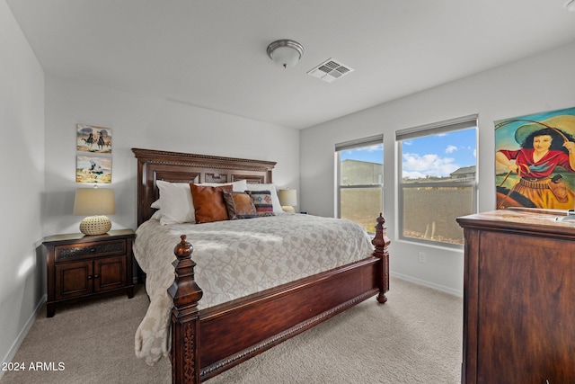 bedroom featuring light colored carpet