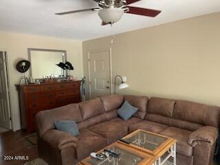 living room with ceiling fan