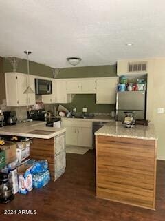 kitchen featuring dark hardwood / wood-style flooring, decorative light fixtures, black range, white cabinetry, and stainless steel refrigerator