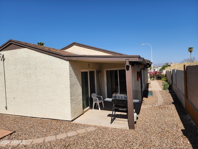 back of property featuring a patio area