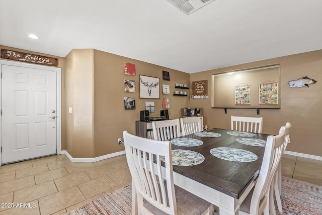 dining area with tile patterned floors