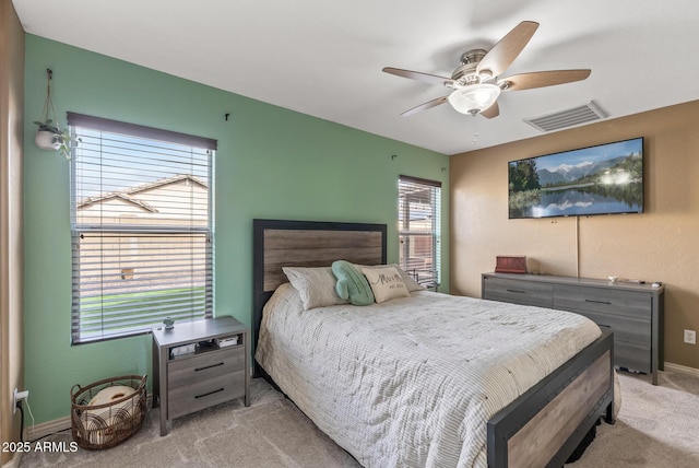 bedroom featuring ceiling fan and light colored carpet