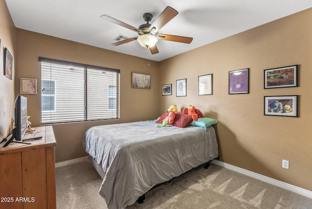 bedroom with ceiling fan and carpet floors