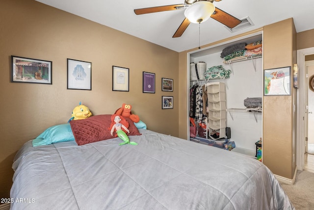 carpeted bedroom with a closet and ceiling fan