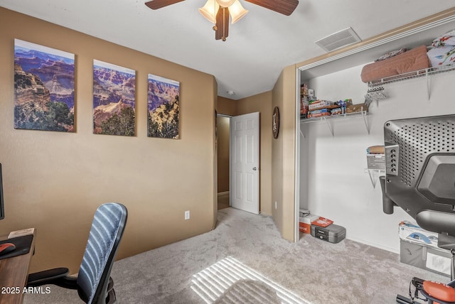 office featuring light carpet and ceiling fan