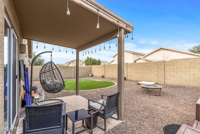 view of patio with a fire pit