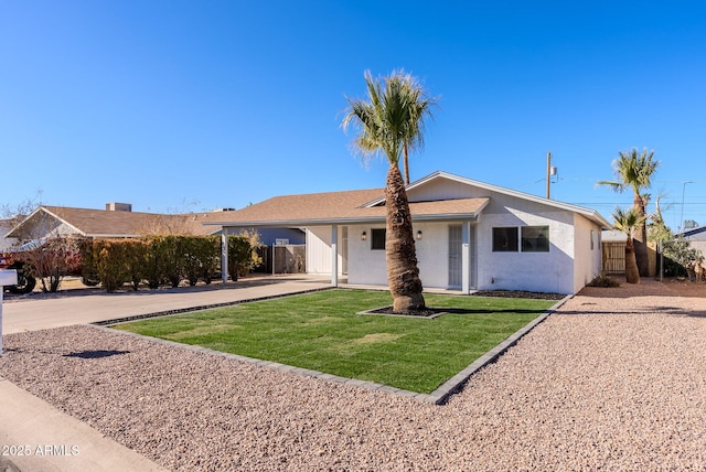 ranch-style house with a front yard