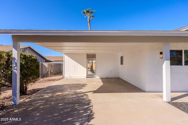 view of parking / parking lot featuring a carport