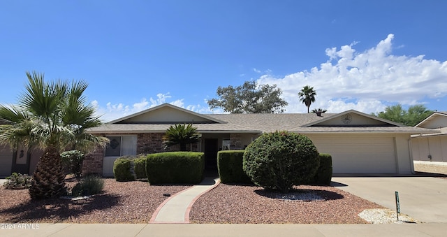 ranch-style home featuring a garage