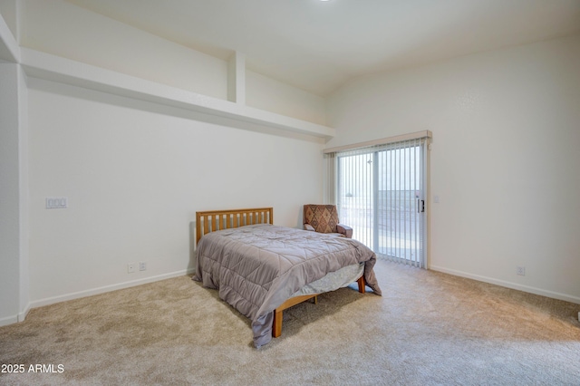 bedroom featuring light carpet, access to outside, and lofted ceiling