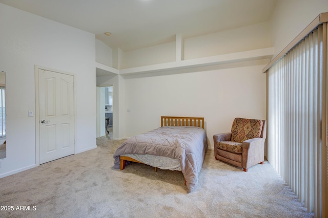 bedroom with high vaulted ceiling and carpet flooring