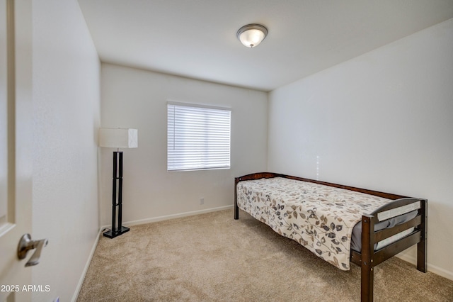 bedroom featuring light colored carpet