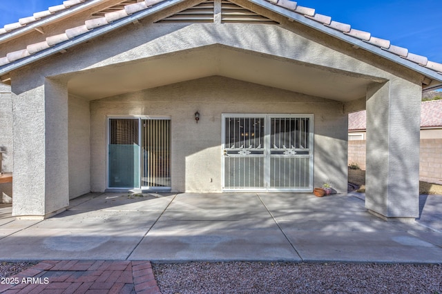 back of property featuring a patio area