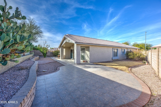 rear view of property with a patio