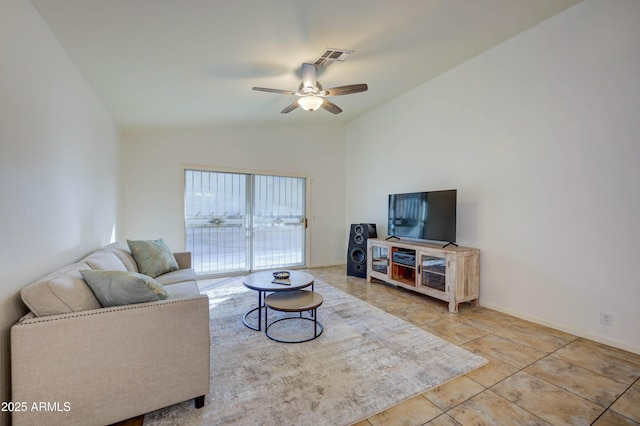 tiled living room with lofted ceiling and ceiling fan