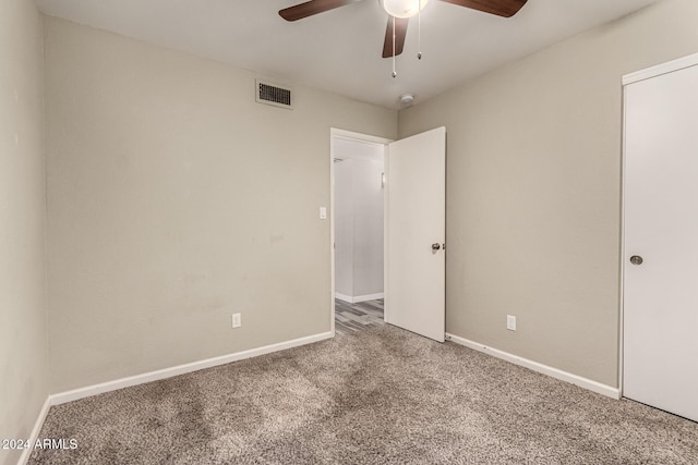 unfurnished bedroom featuring carpet flooring and ceiling fan