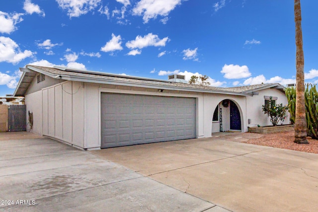 single story home featuring a garage