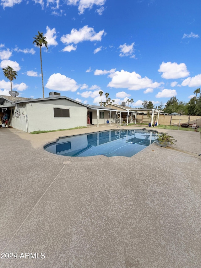 view of swimming pool featuring a patio area