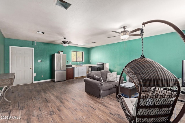 38222 N 19th Ave, Phoenix, AZ 85086 - living area featuring a ceiling fan, dark wood finished floors, and baseboards