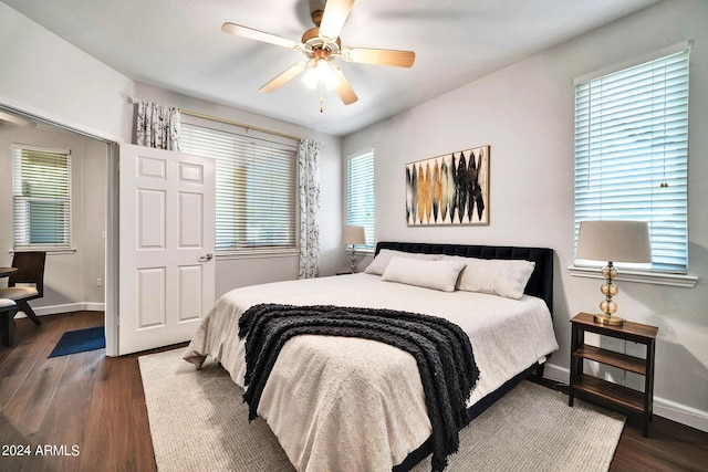 bedroom featuring dark wood-type flooring and ceiling fan