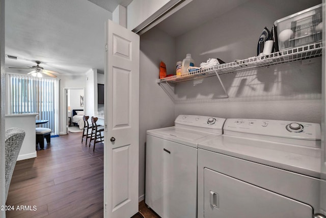 laundry area with ceiling fan, dark hardwood / wood-style floors, and washer and dryer