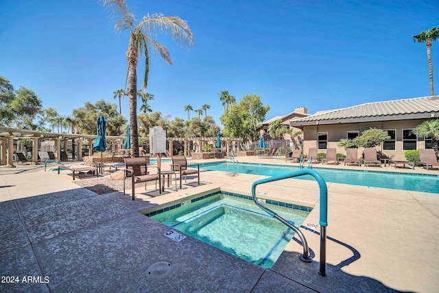 view of pool with a patio area and a community hot tub