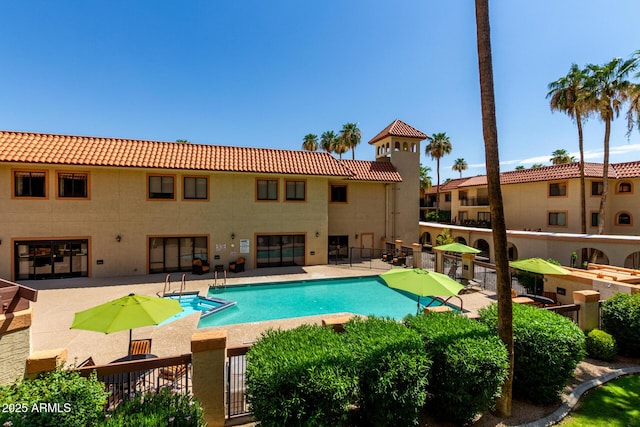 10330 W Thunderbird Blvd Unit C207, Sun City, AZ 85351 - view of pool featuring a pool with connected hot tub and a patio