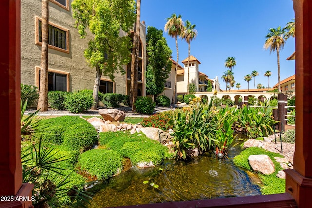 10330 W Thunderbird Blvd Unit C207, Sun City, AZ 85351 - view of property's community with a small pond