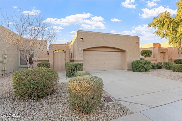 southwest-style home with a garage