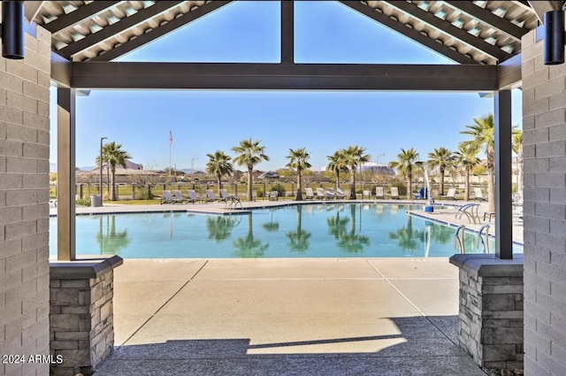 community pool with a patio area