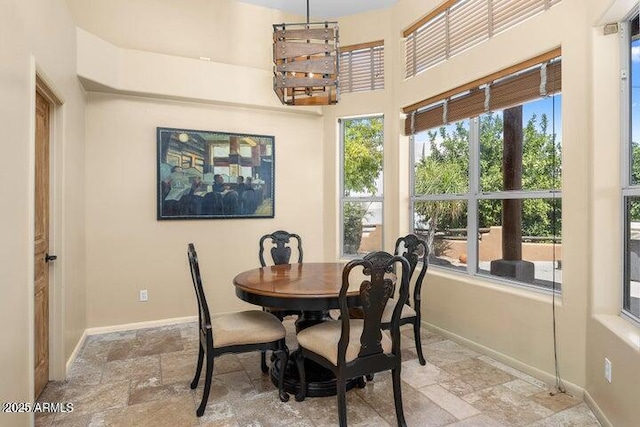 dining area with a chandelier and a healthy amount of sunlight